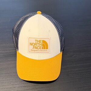 The North Face Cream and Yellow Cap